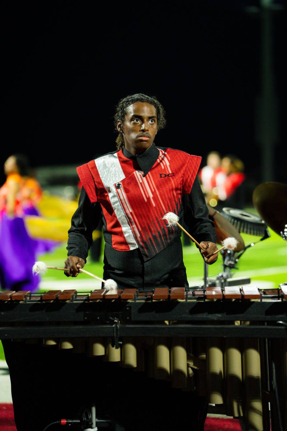 Front ensemble marimba player performing