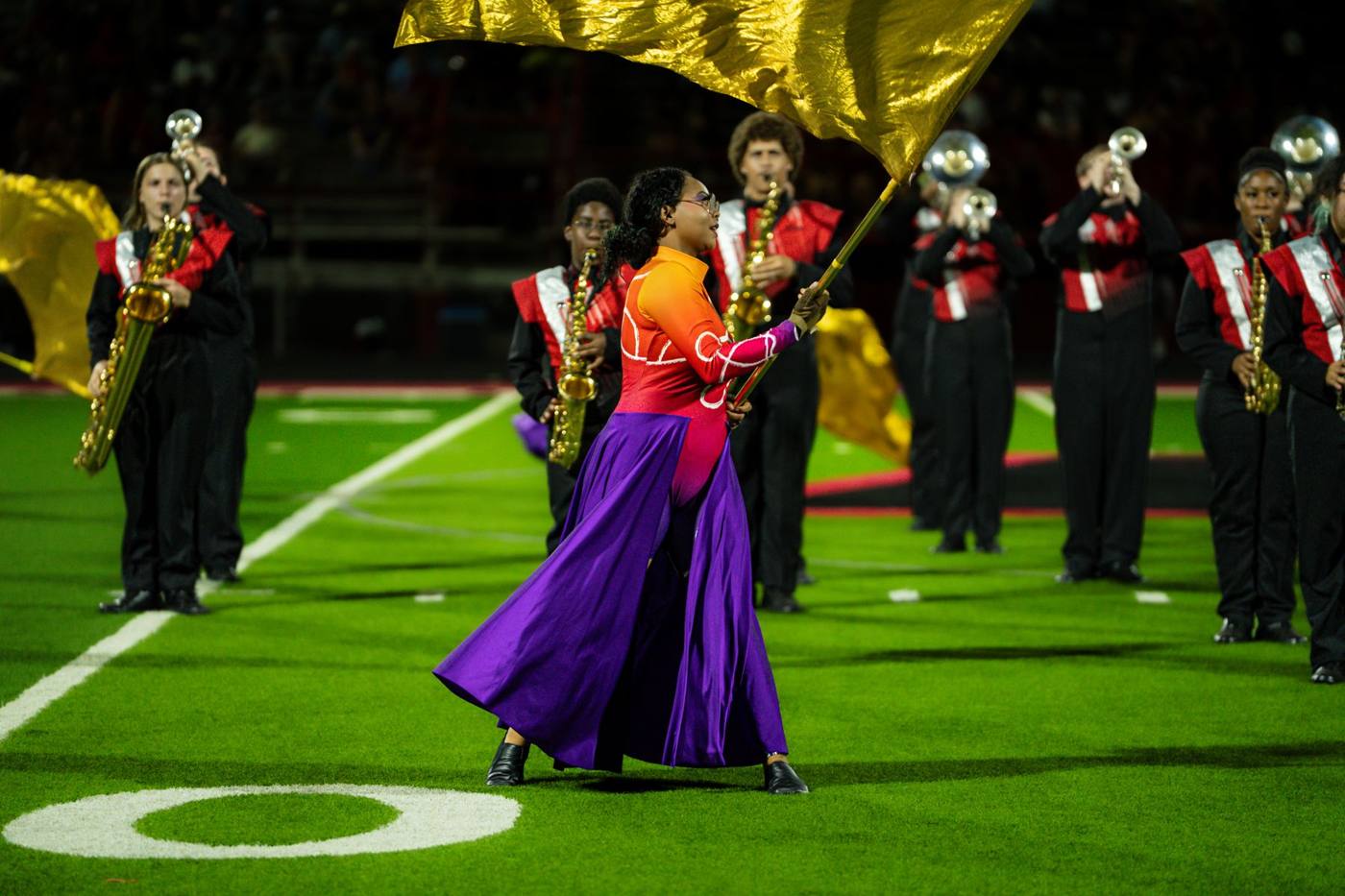 Color guard flag feature in front of the saxophone line