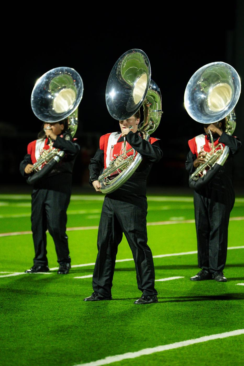 Sousaphone line in red and black uniforms