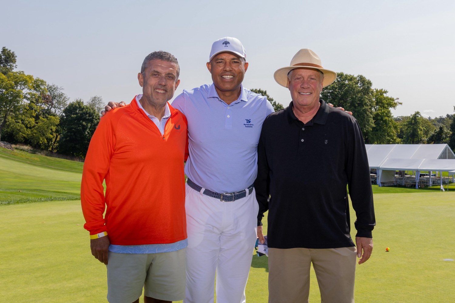 Three guests with Mariano Rivera at Metropolis Country Club