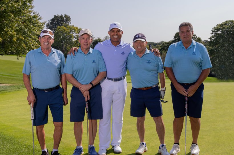 A foursome photographed with Mariano Rivera
