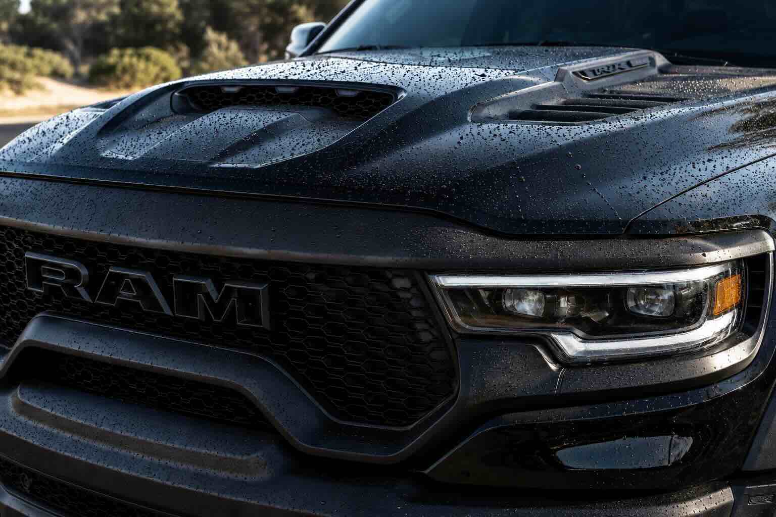Glossy, clean ceramic-coated car with water beading on the surface