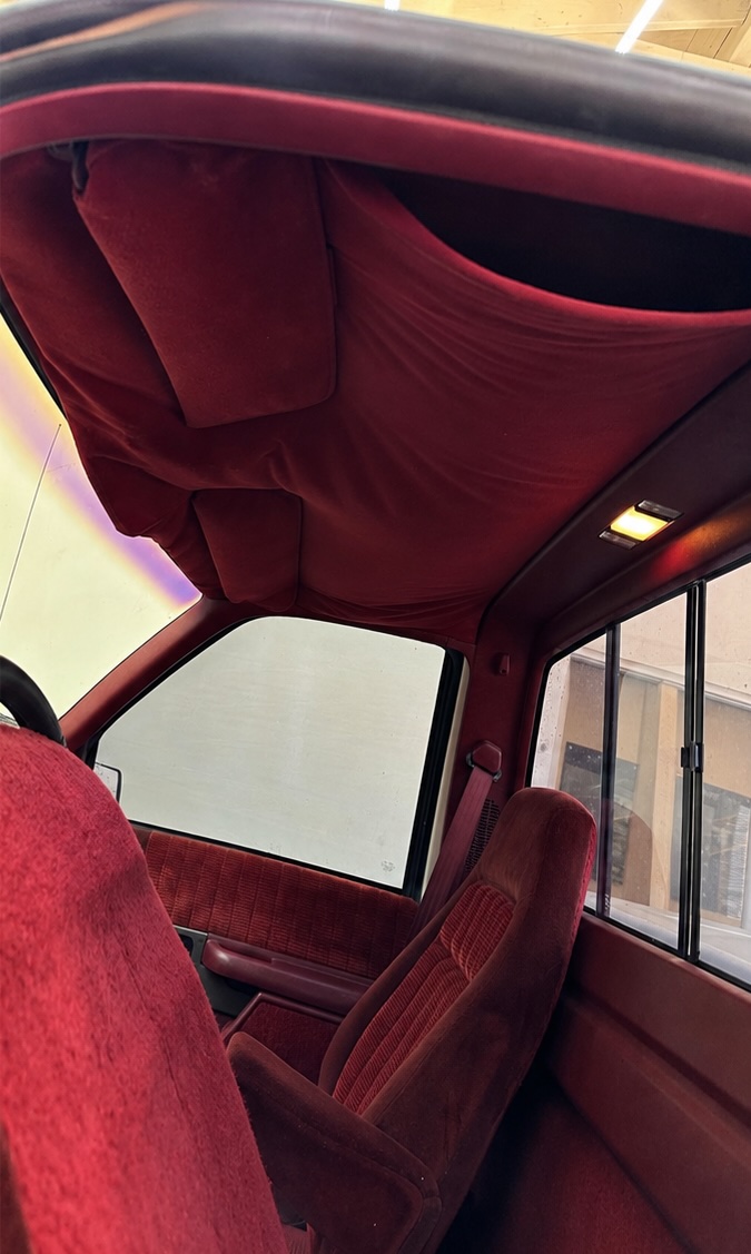 Sagging, damaged headliner before repair, example 1