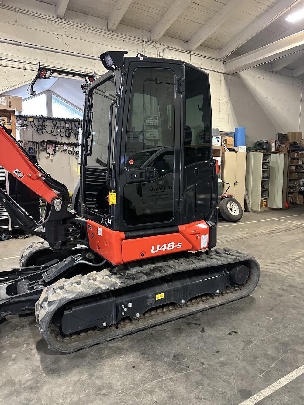 Heavy machinery cab tinted for heat reduction