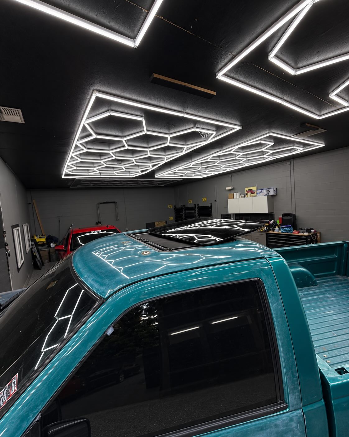 Sunroof wind deflector installed on vehicle roofline, view 2