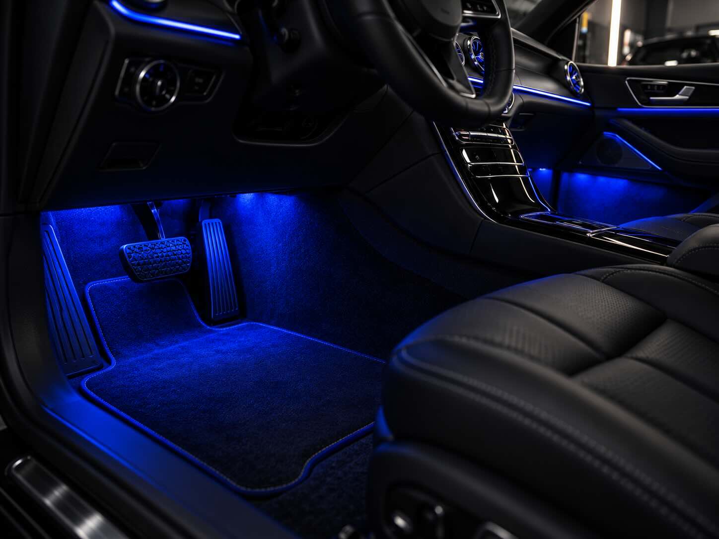 Ambient lighting installed in footwells
