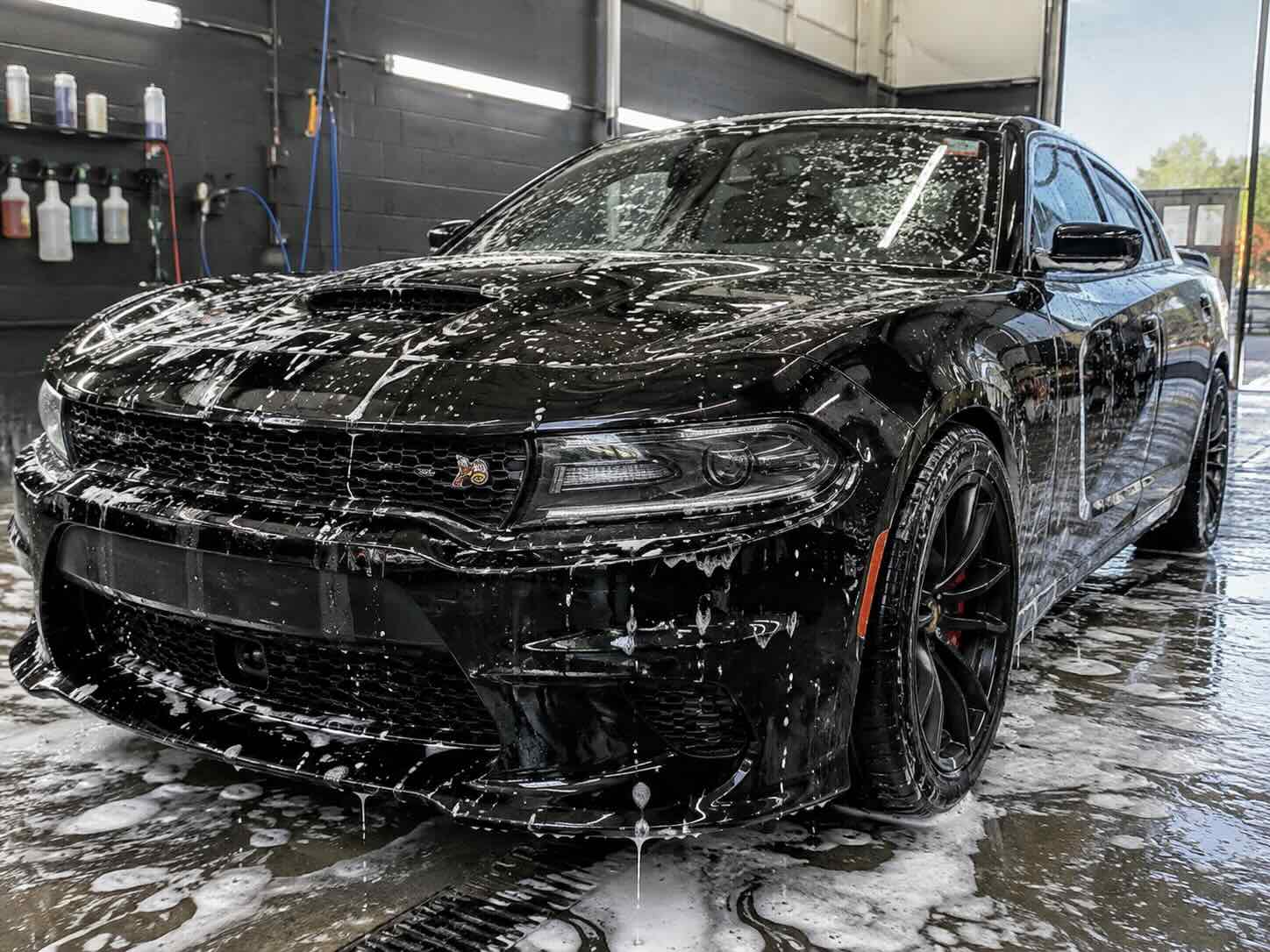 Dodge Charger Scat Pack being cleaned with a foam wash