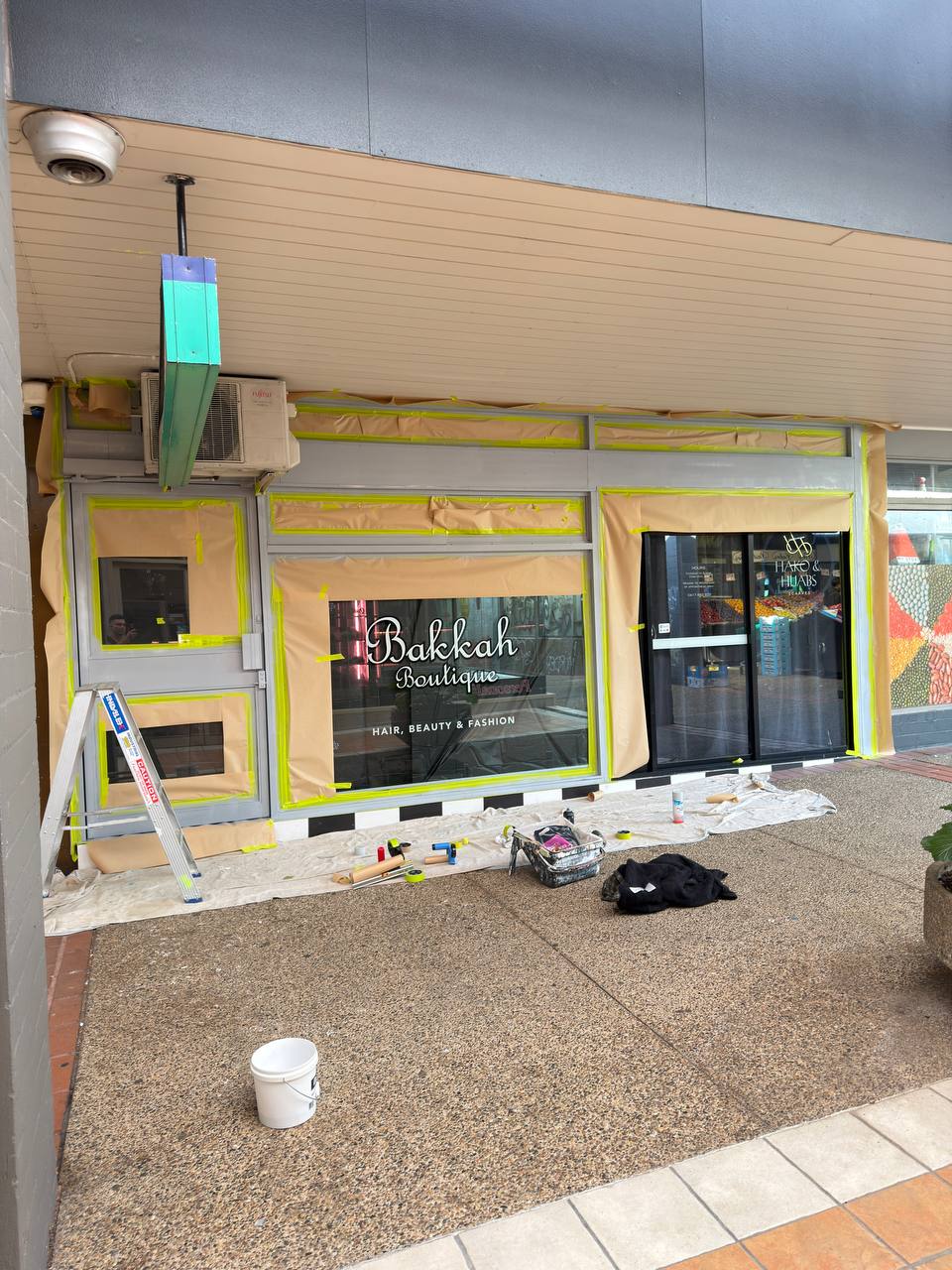 Masking and preparation detail on a commercial paint job