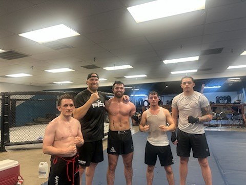 Wildside Nashville MMA team in front of the cage at Music Valley
