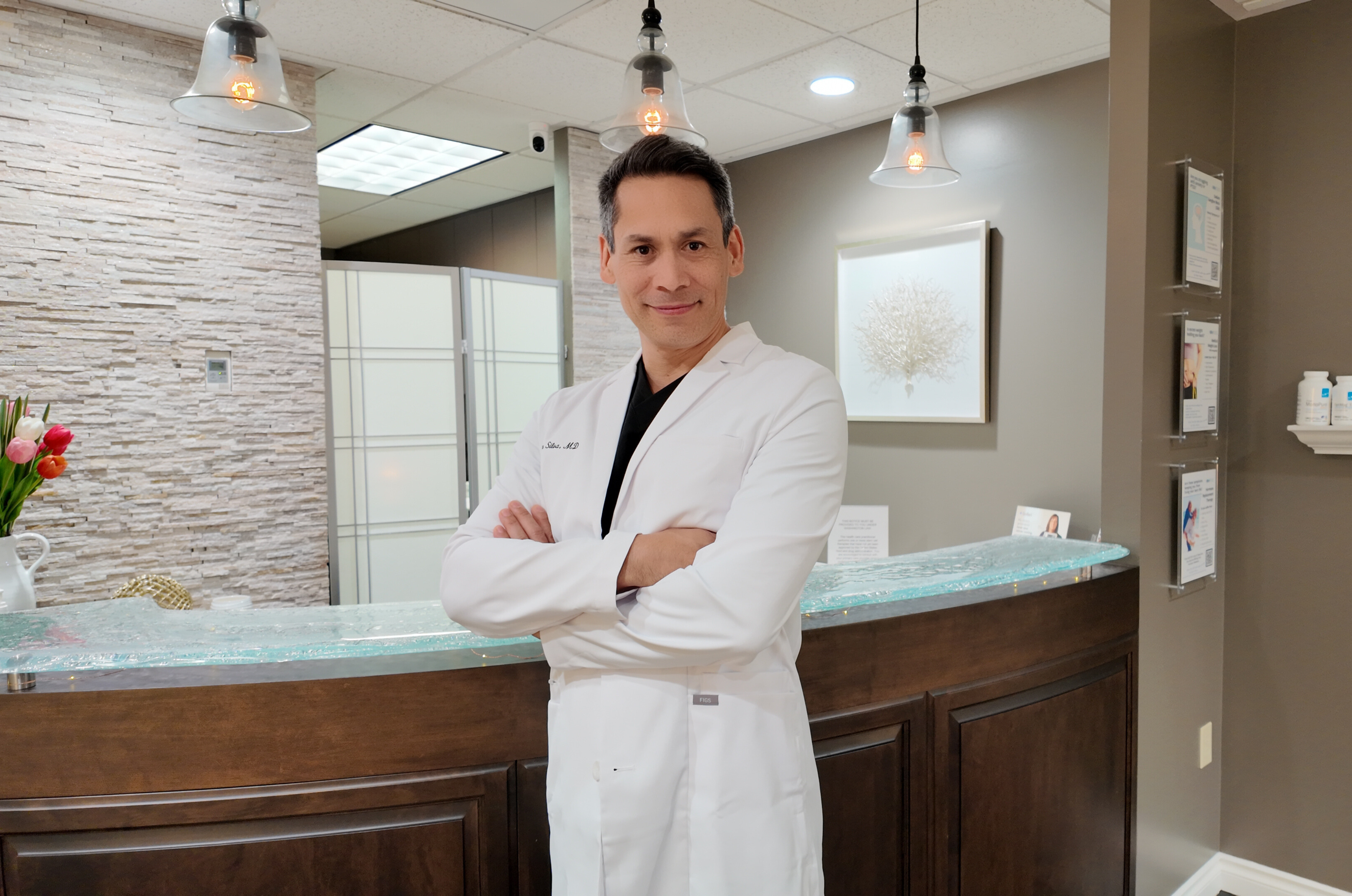 Dr. Otoño Silva standing in clinic