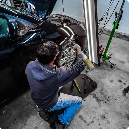 Paintless Dent Repair Technician at Work
