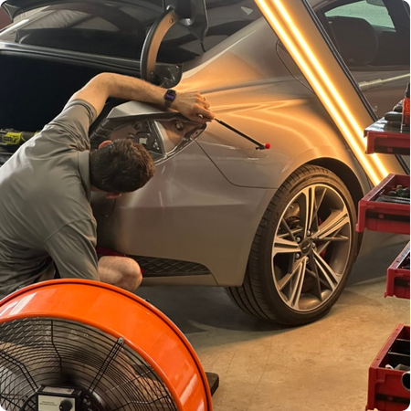 Paintless Dent Repair Technician at Work