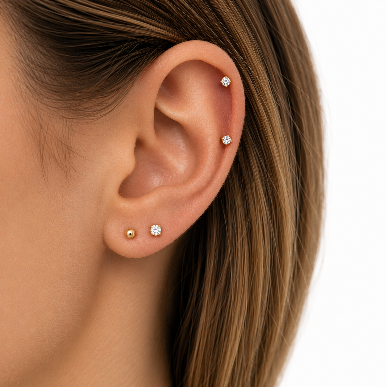 Ear curation example with layered lobe and helix piercings
