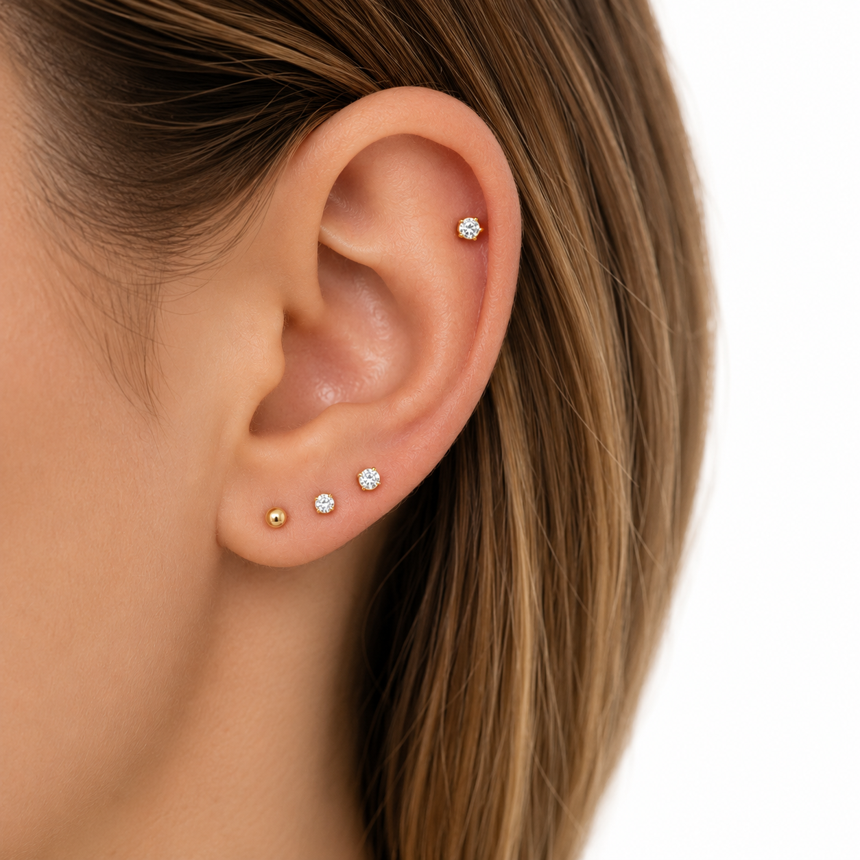 Ear curation example with layered lobe and helix piercings