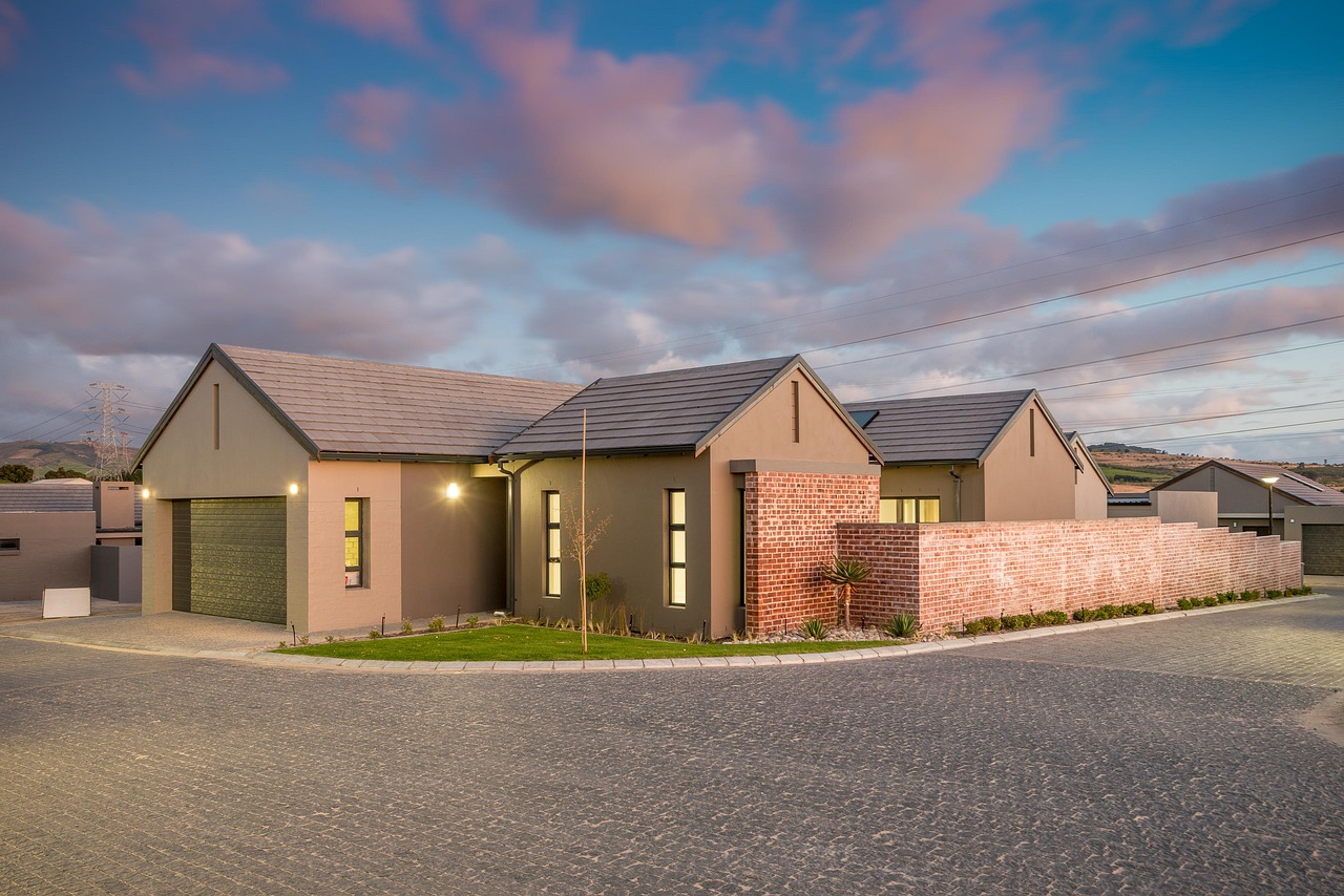 Modern residential home exterior with clean driveway and walkway