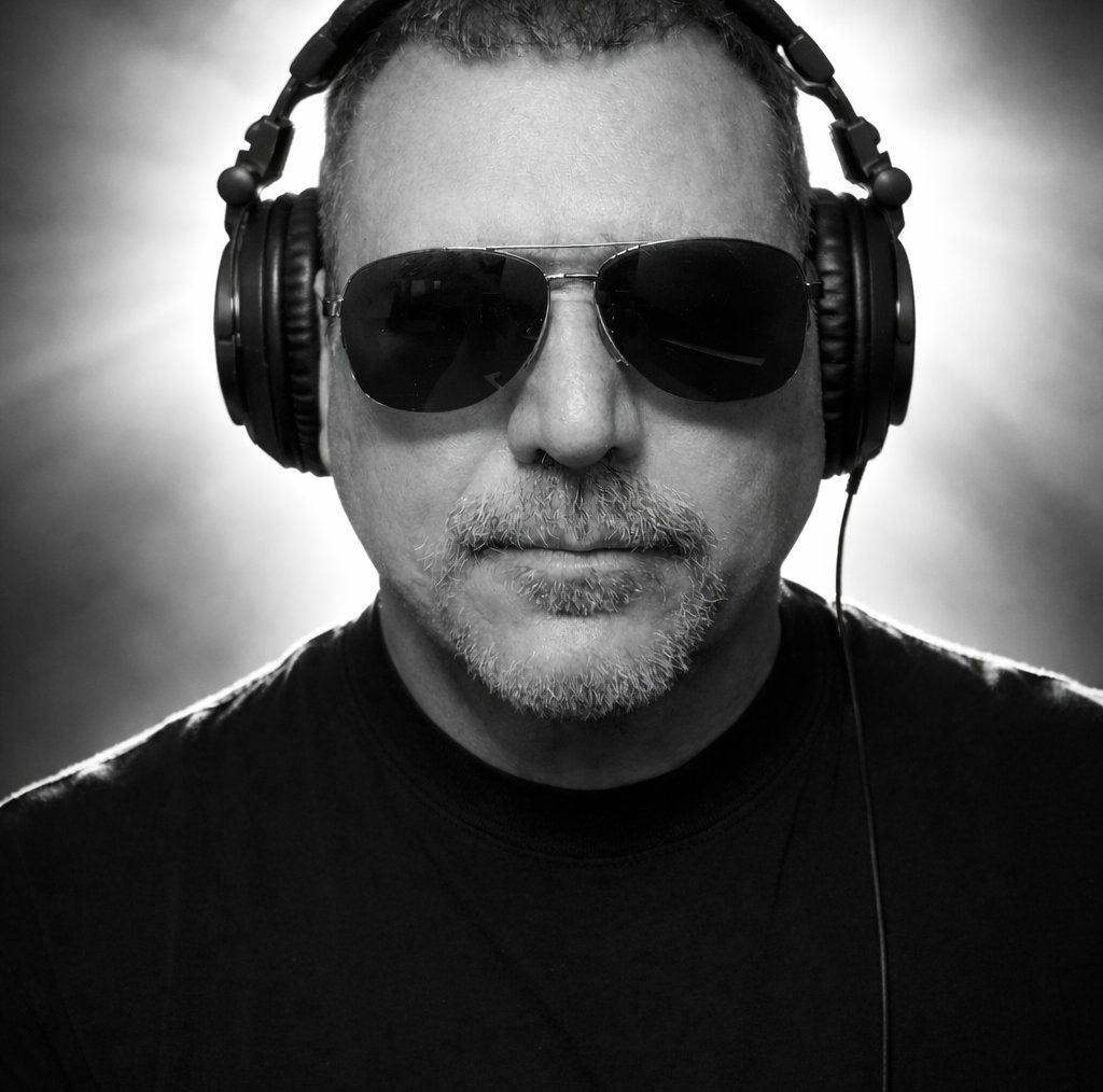 Lewis A. Martineé wearing headphones