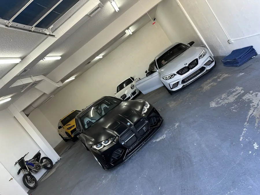 Several customer performance cars waiting in the Copperstate shop bay