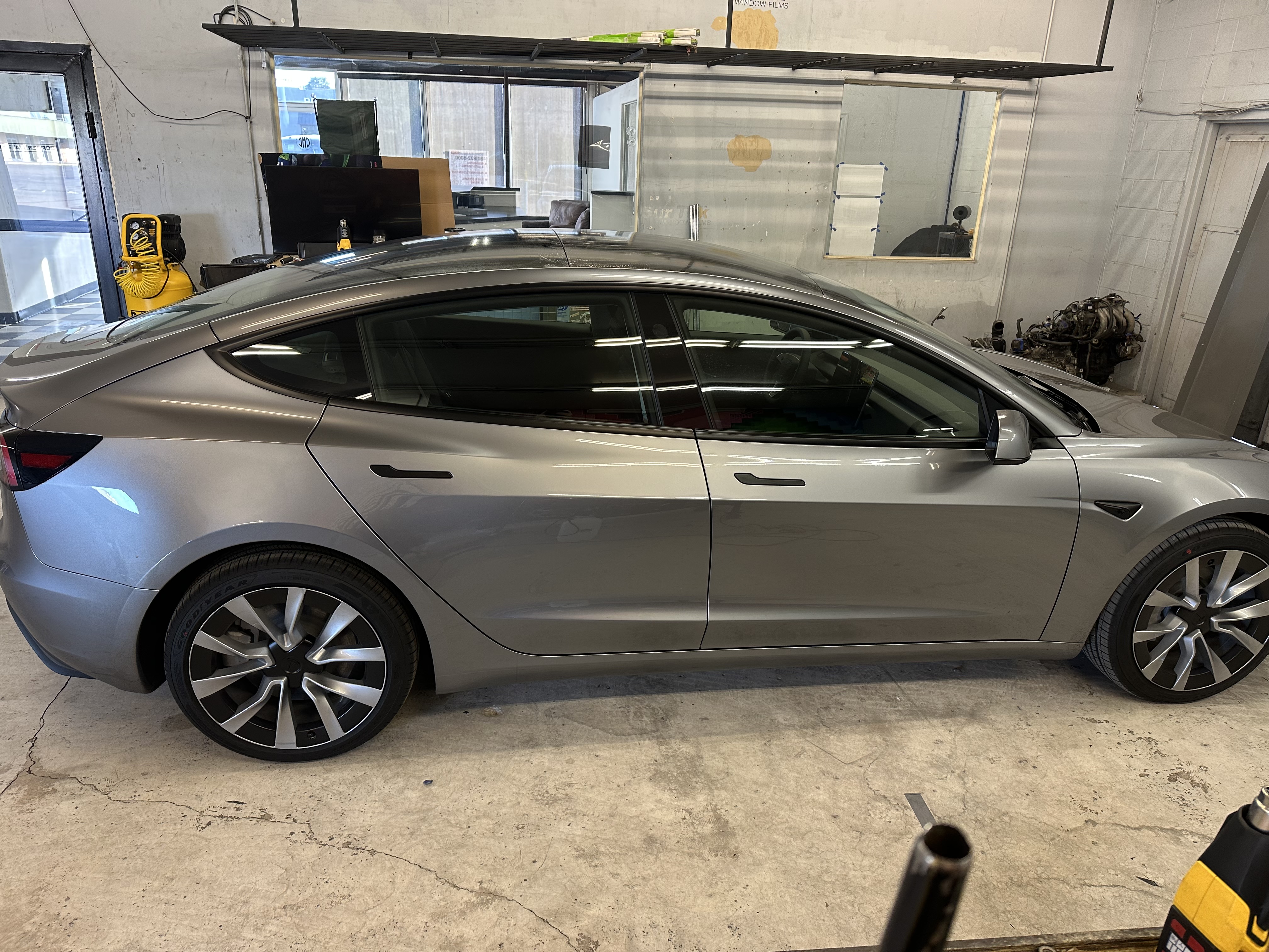 Tesla Model 3 side view showing one-piece rear glass tint
