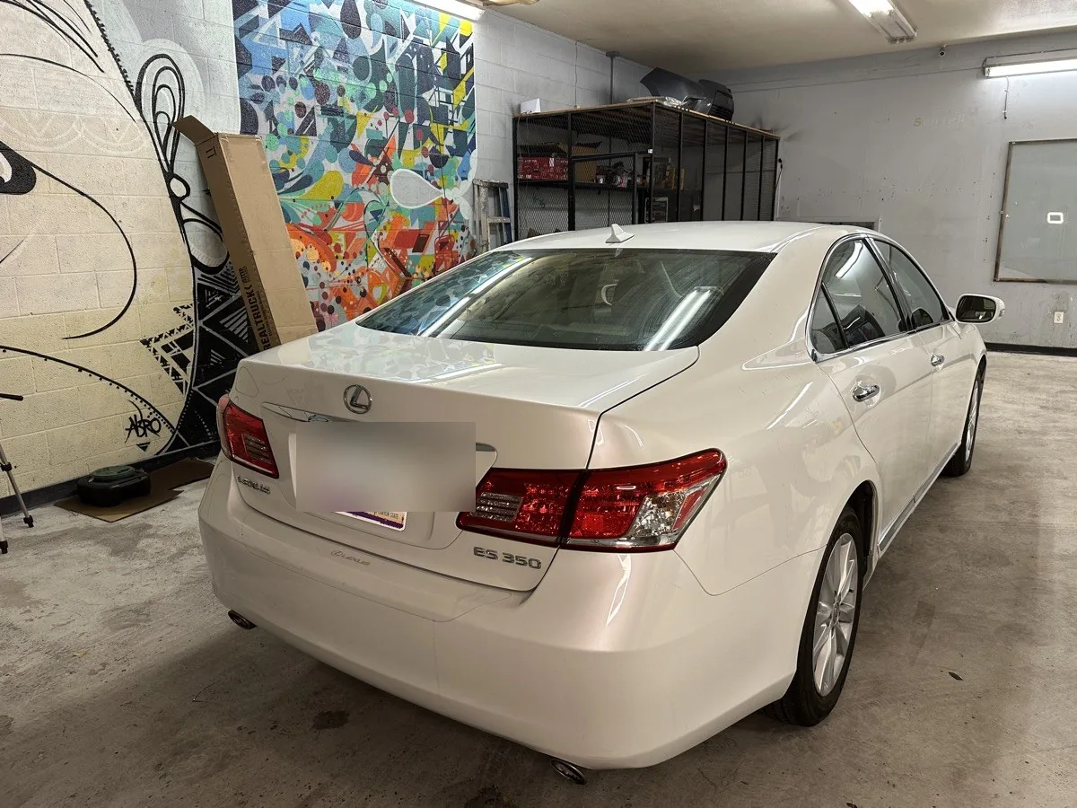 Completed ceramic tint on the rear glass and side windows of a white Lexus ES 350