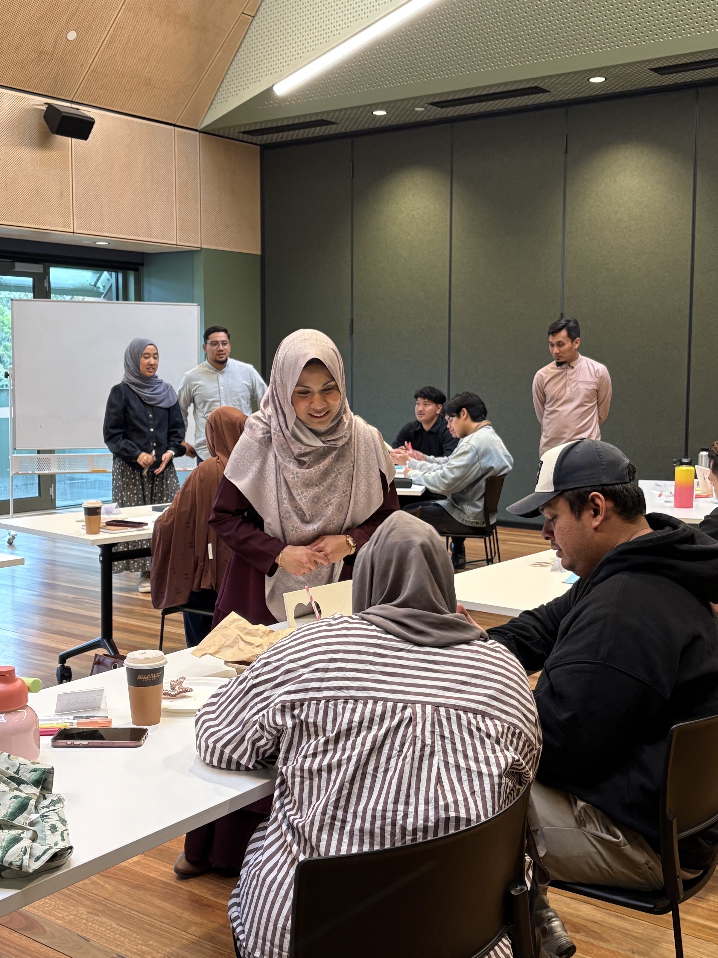 Participants talking and working together during an exercise