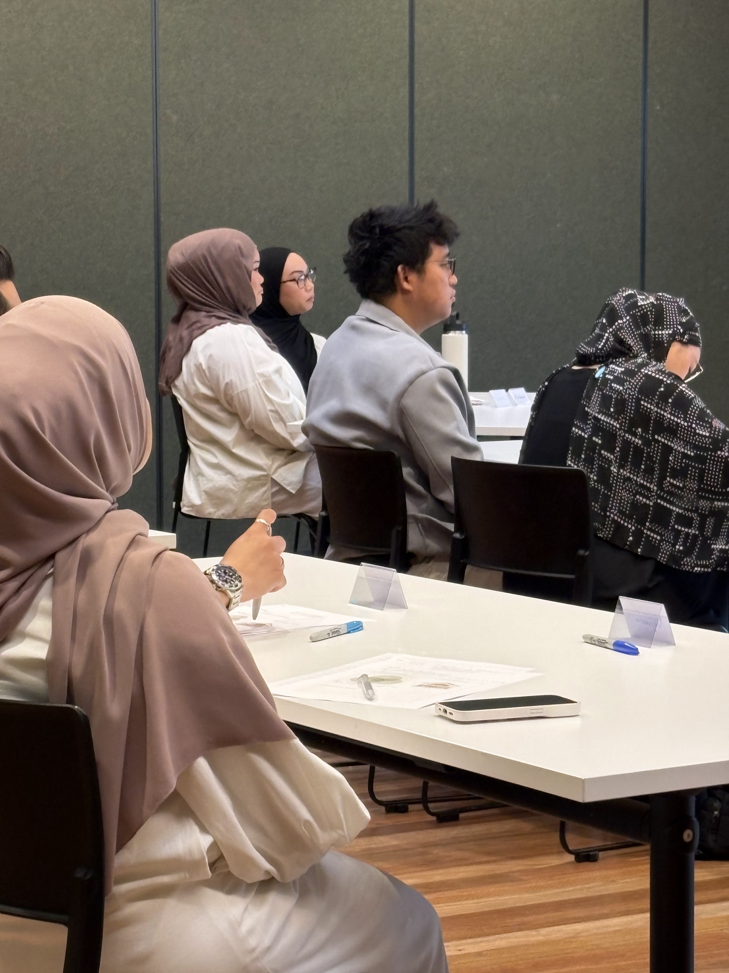 Couples seated and listening during the workshop