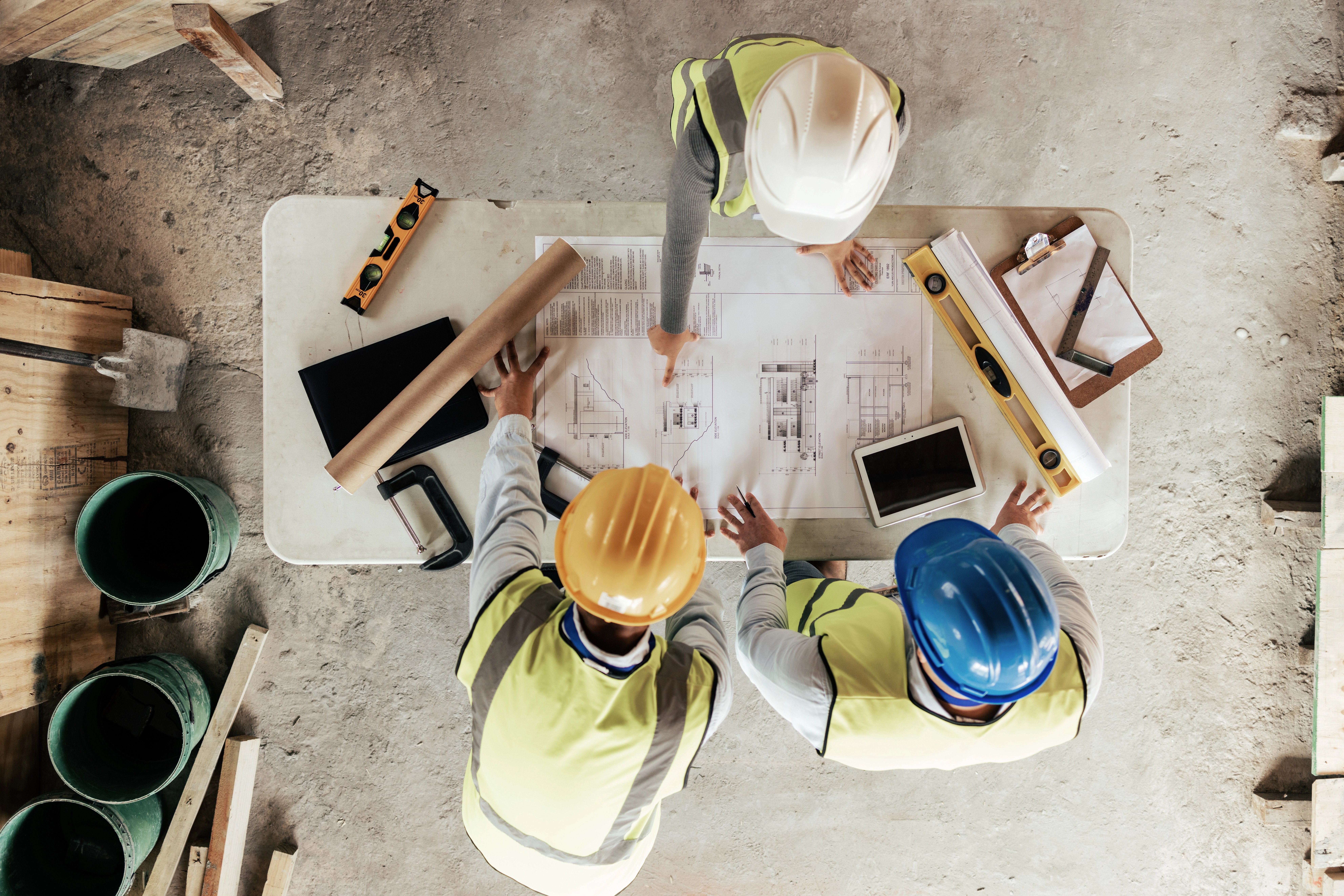 Professionals reviewing architectural plans together