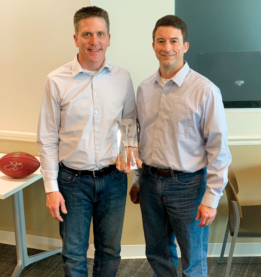 Darin and Erik receiving award from Infios