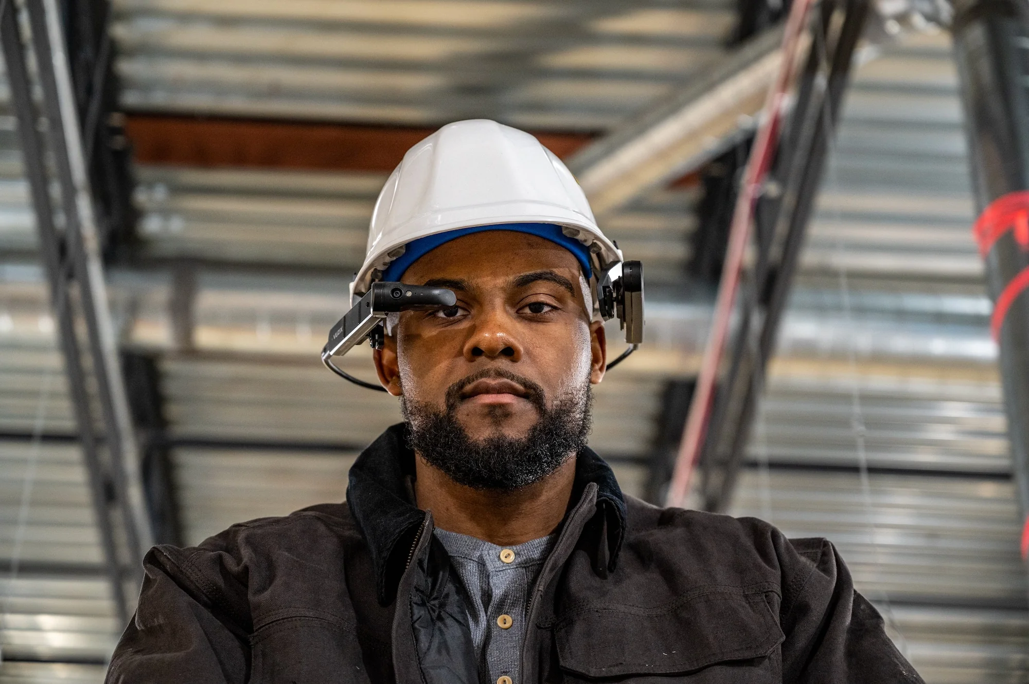 Vuzix M400 smart glasses worn on a hard hat Vuzix M400 smart glasses worn on a hard hat