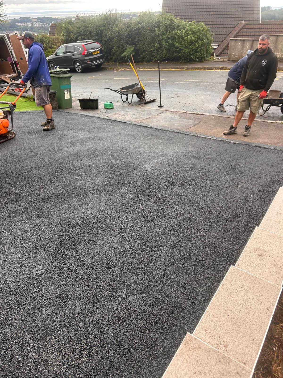 Resin surface being pressure cleaned in Newport