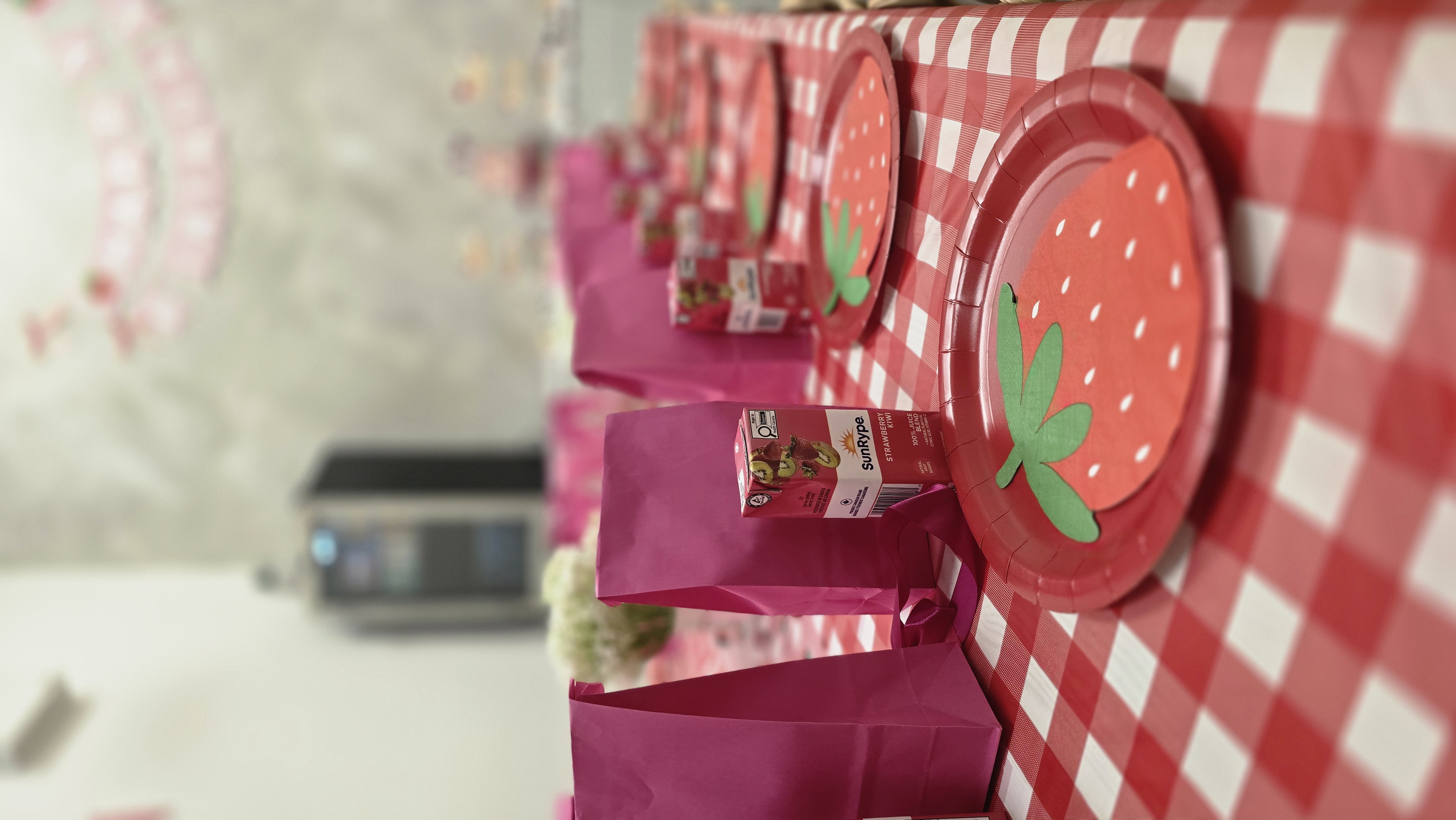 A calm party moment with a plain cake and soft bunting
