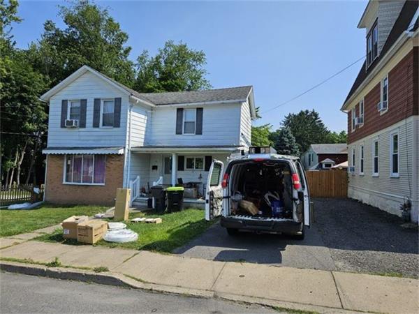 Wrapped K.O. HVAC service van parked in the driveway of a home on a Wyoming Valley street
