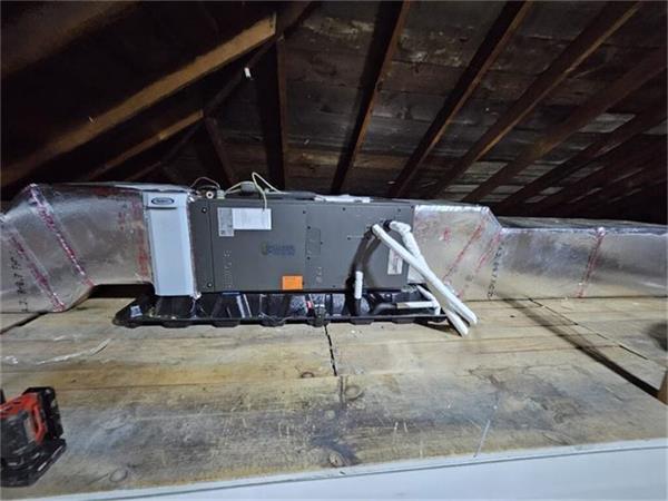 New air handler and insulated ductwork installed by K.O. HVAC in a residential attic