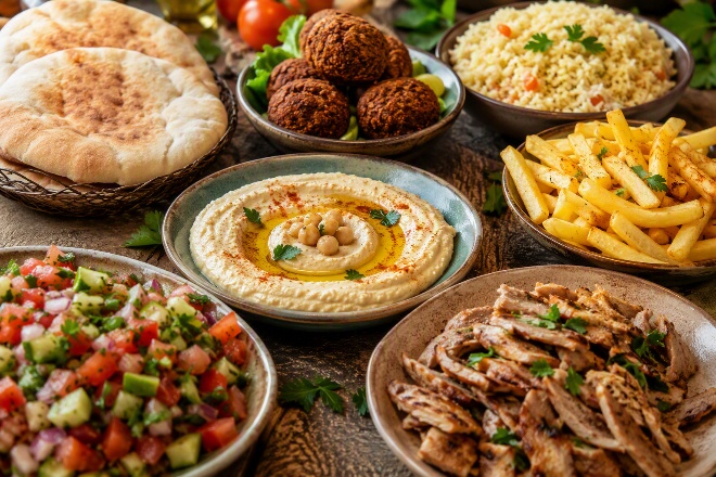 Mediterranean spread with hummus, falafel, pita, salads, fries and shawarma