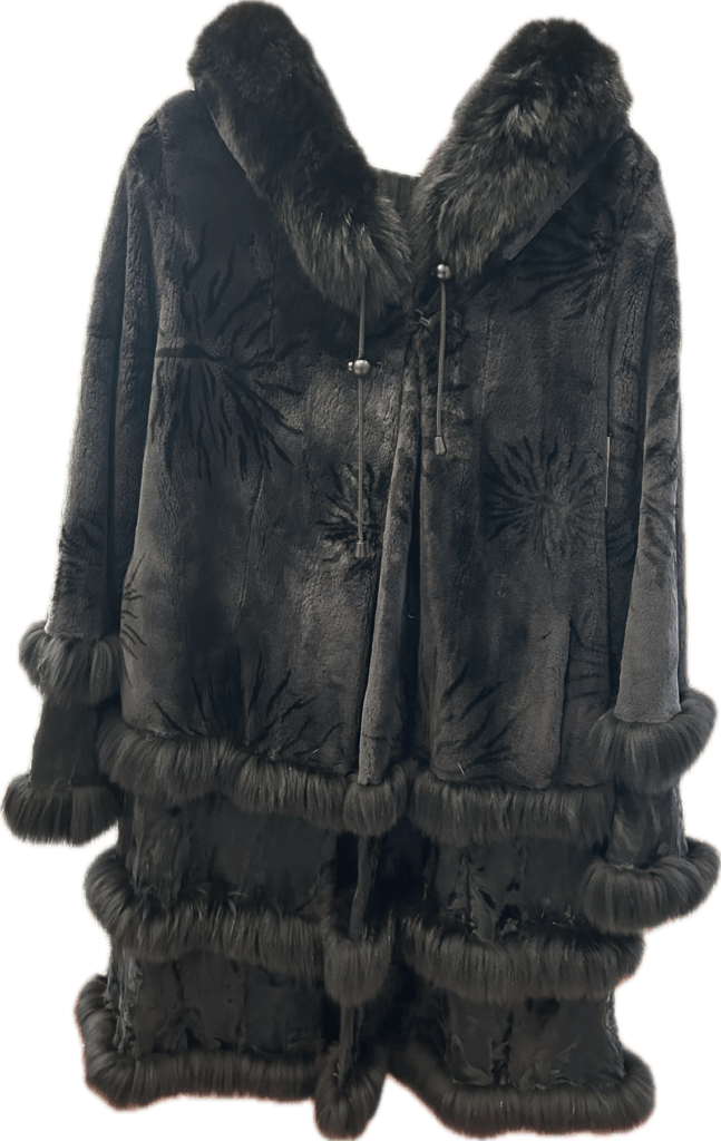 Black fur coat with tiered fur trim at the hem