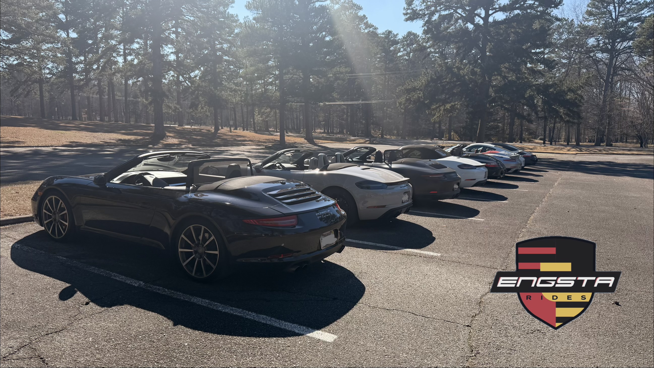 rear view of several Porsche 911's