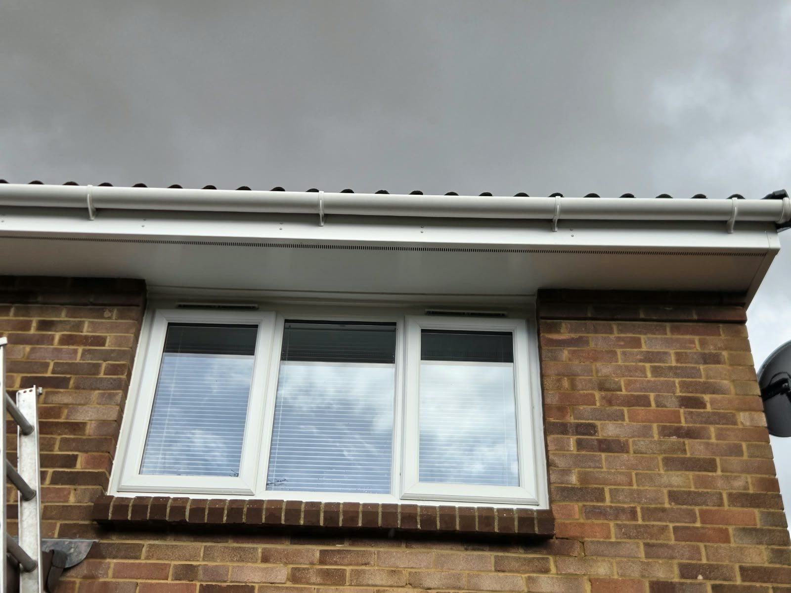 After: the same gutter face and fascia clean