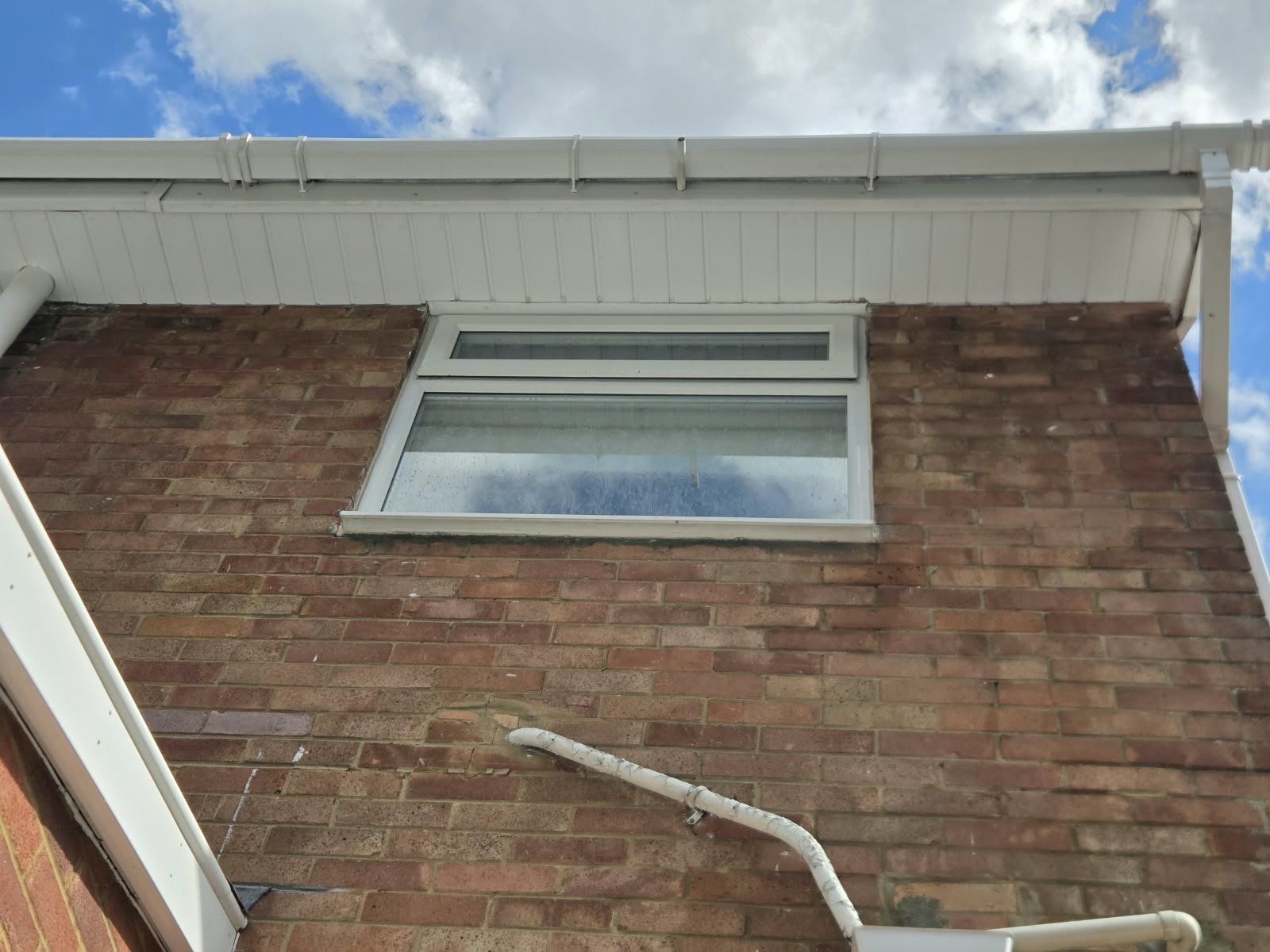 After: the same eaves clean and white