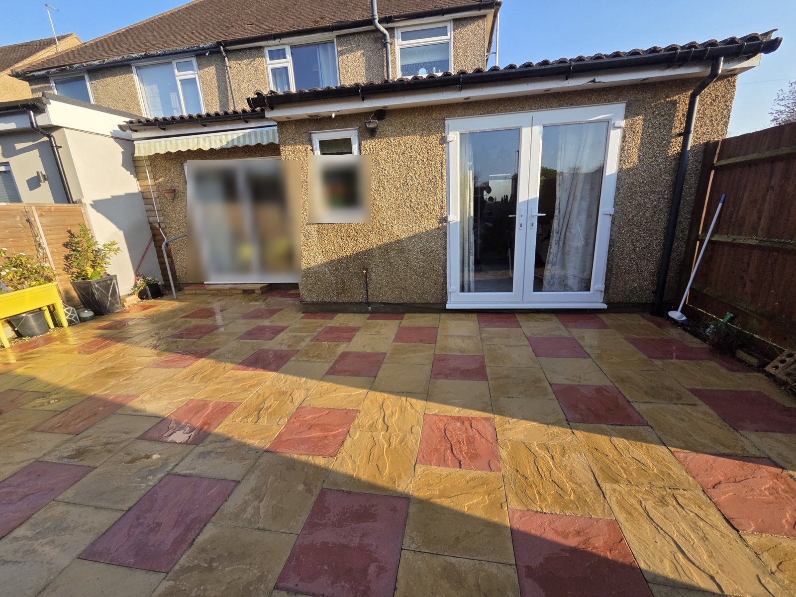 After: the same patio, still wet
