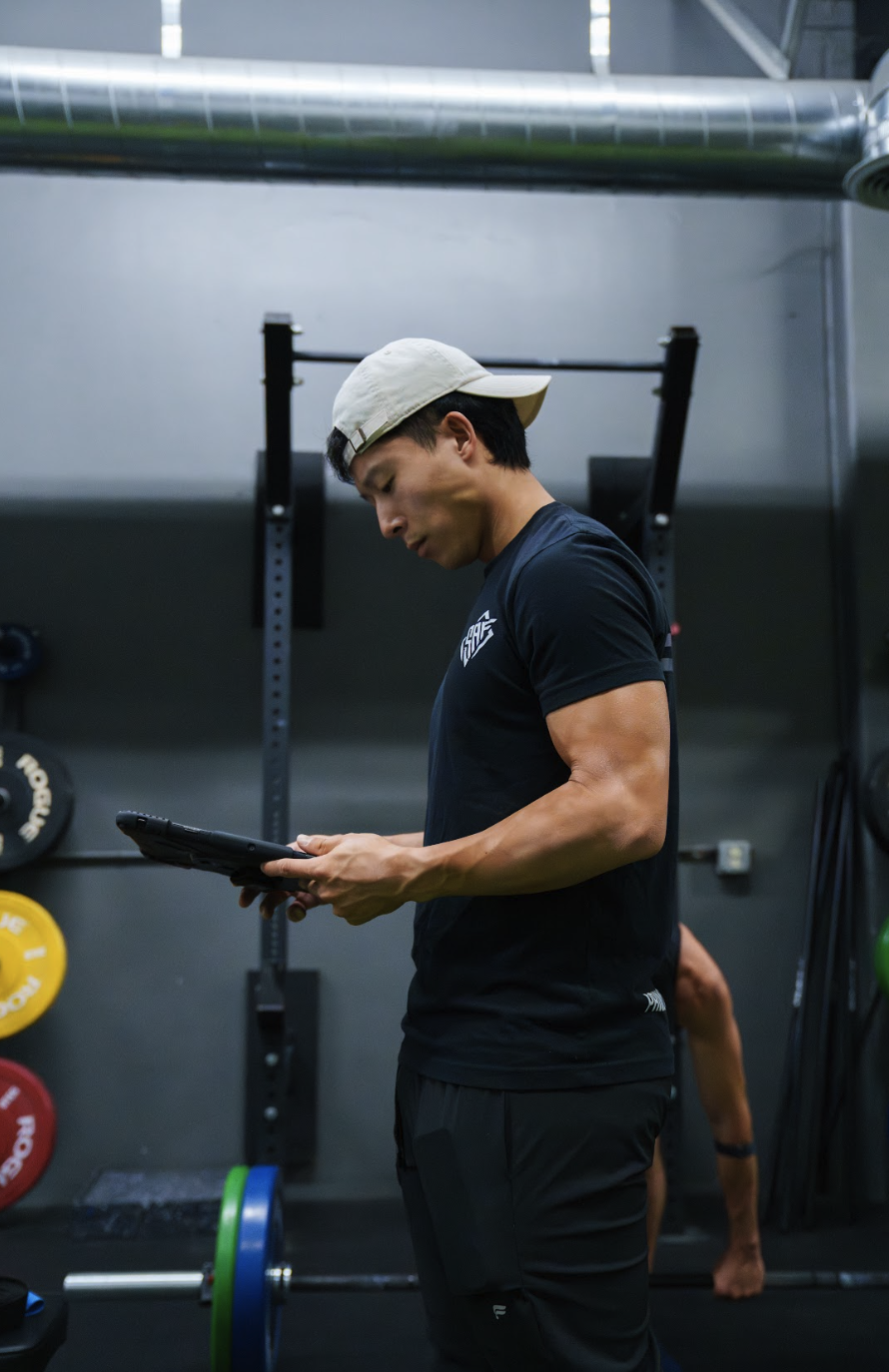 Daniel Baek, NASM certified and Hyrox coach, at Primitive x Swole AF gym in Garden Grove