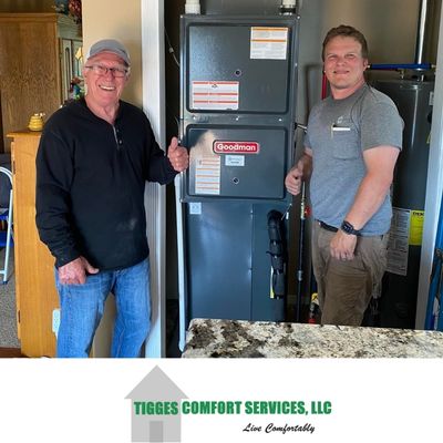 Owner Jason Tigges with happy customer following Goodman Furnace Installation - Dallas County Iowa