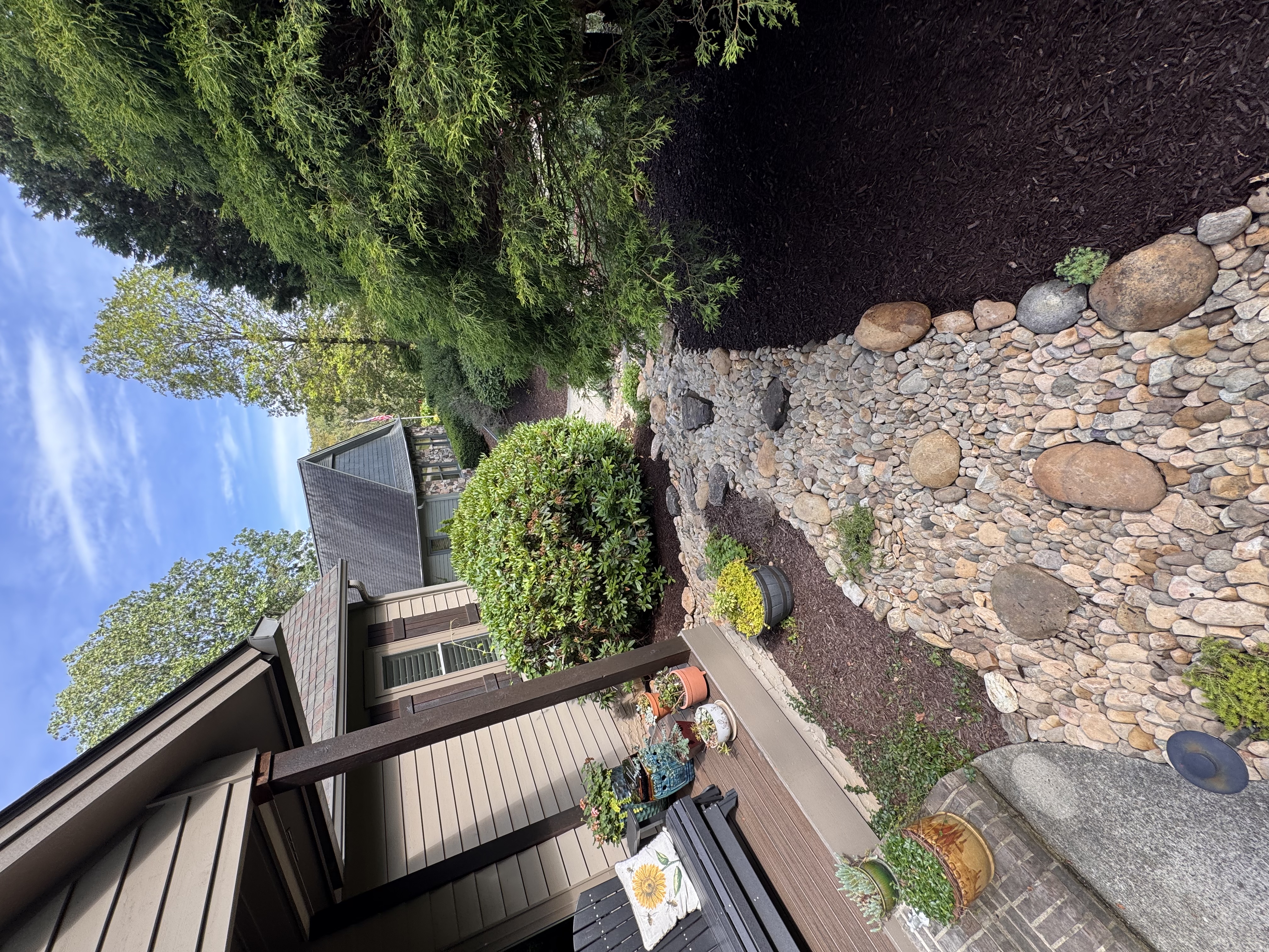 Finished stone path and planting beside a home