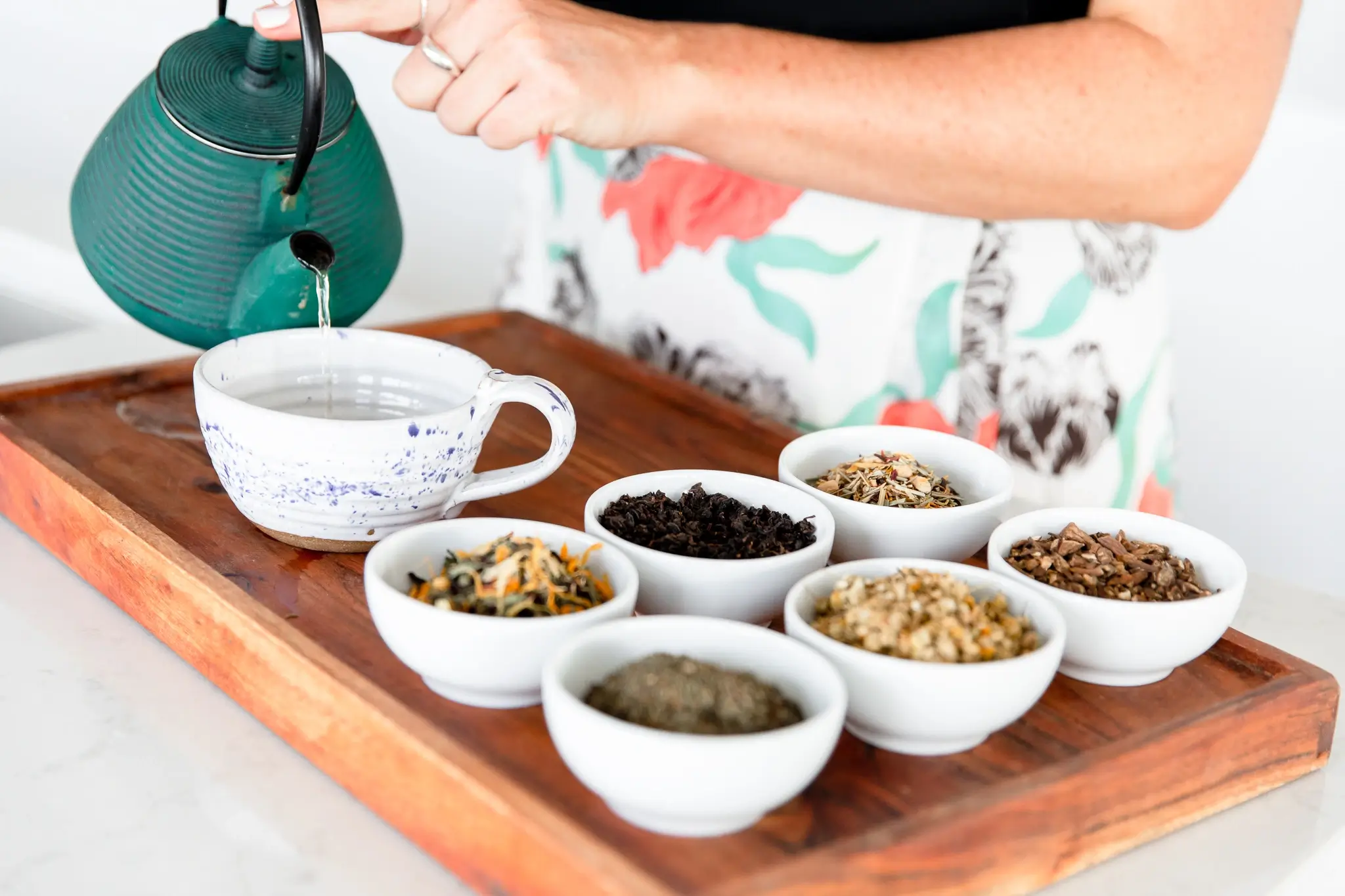 Pouring herbal tea — calming ritual for women’s stress and hormone balance