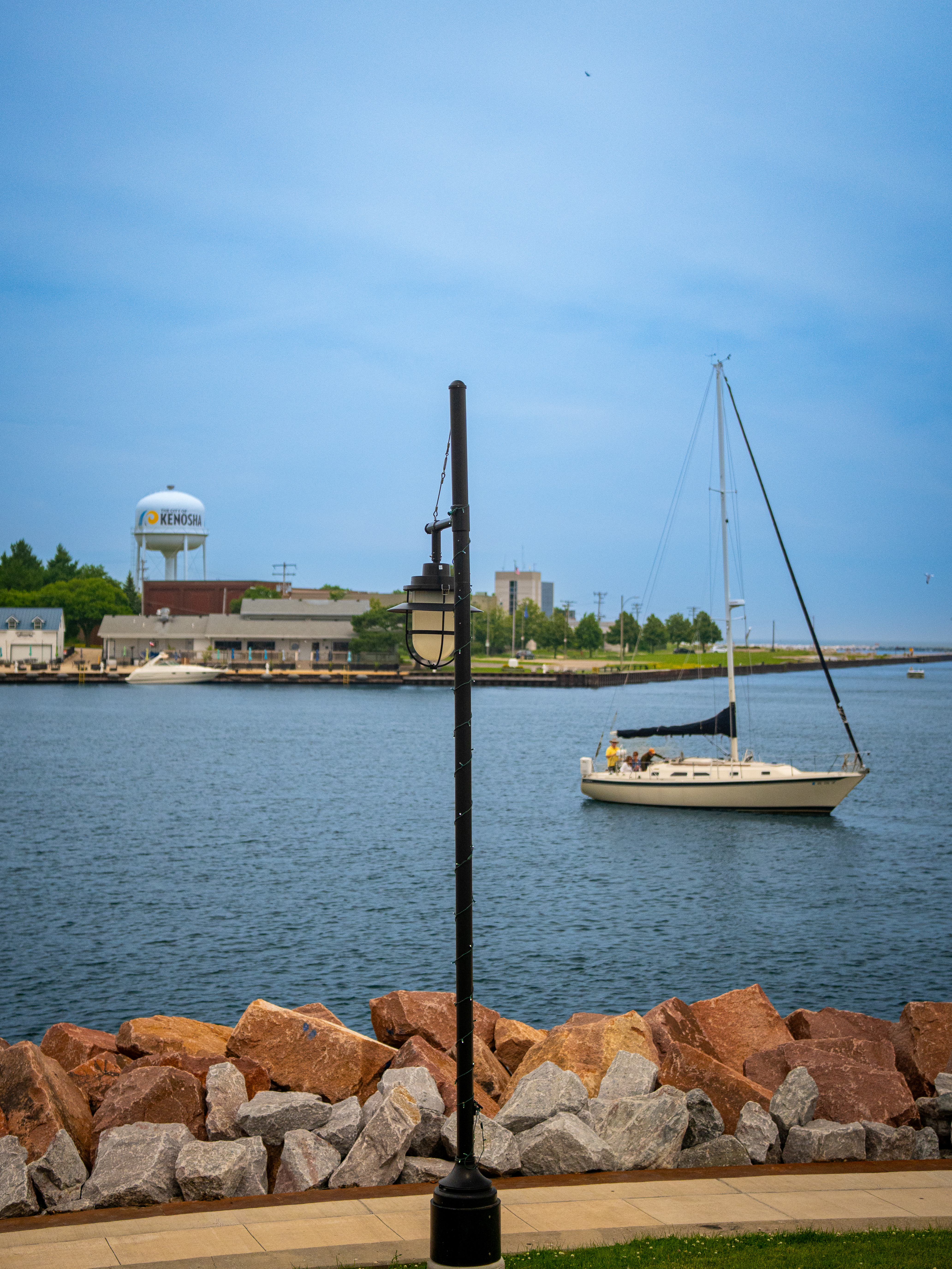 Kenosha water tower overlooking Lake Michigan with a passing boat