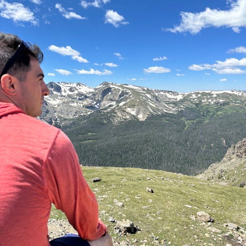 Gabe Pressman looking out over a mountain valley