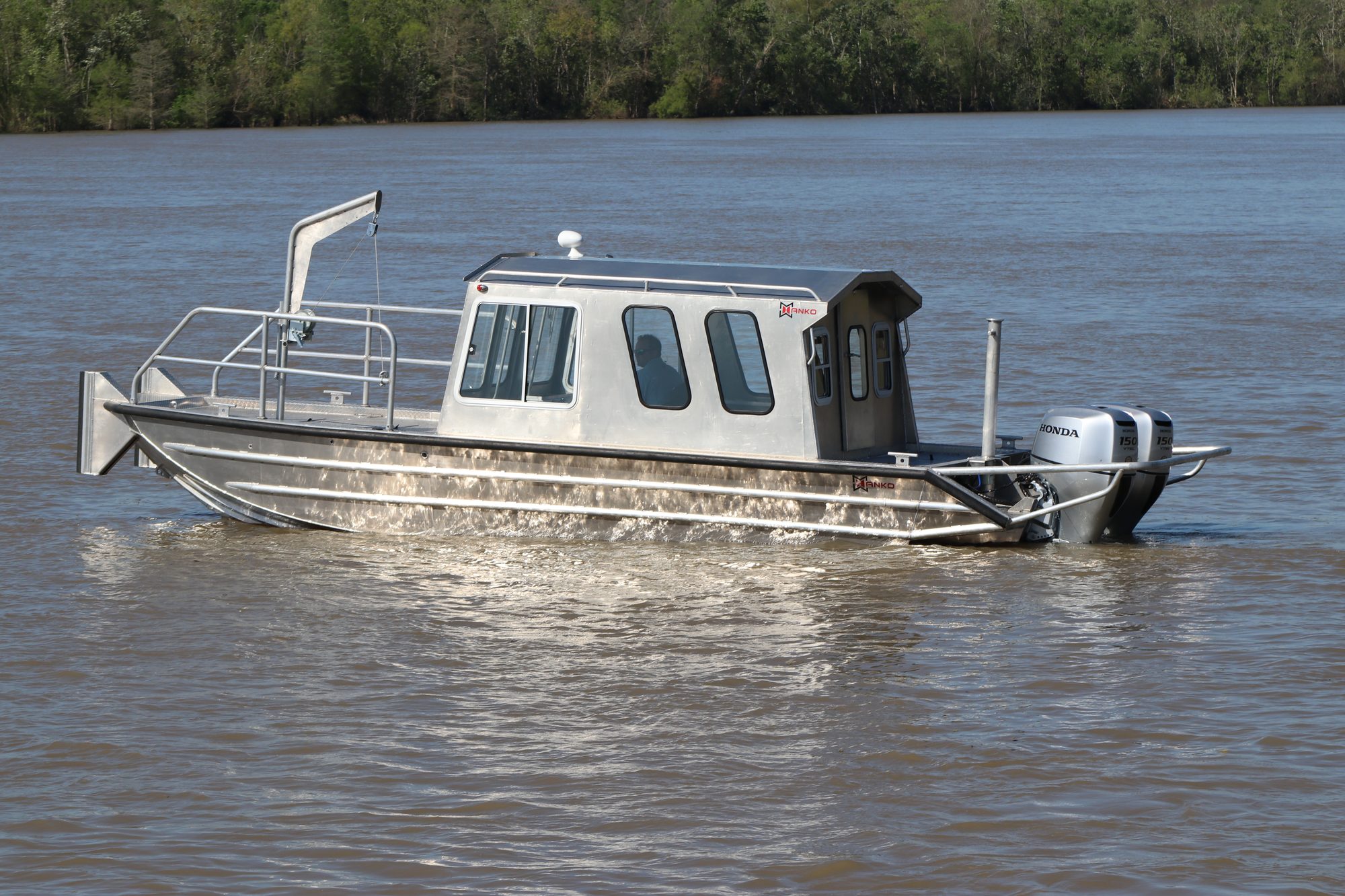 Hanko aluminum cabin boat running on a Louisiana waterway