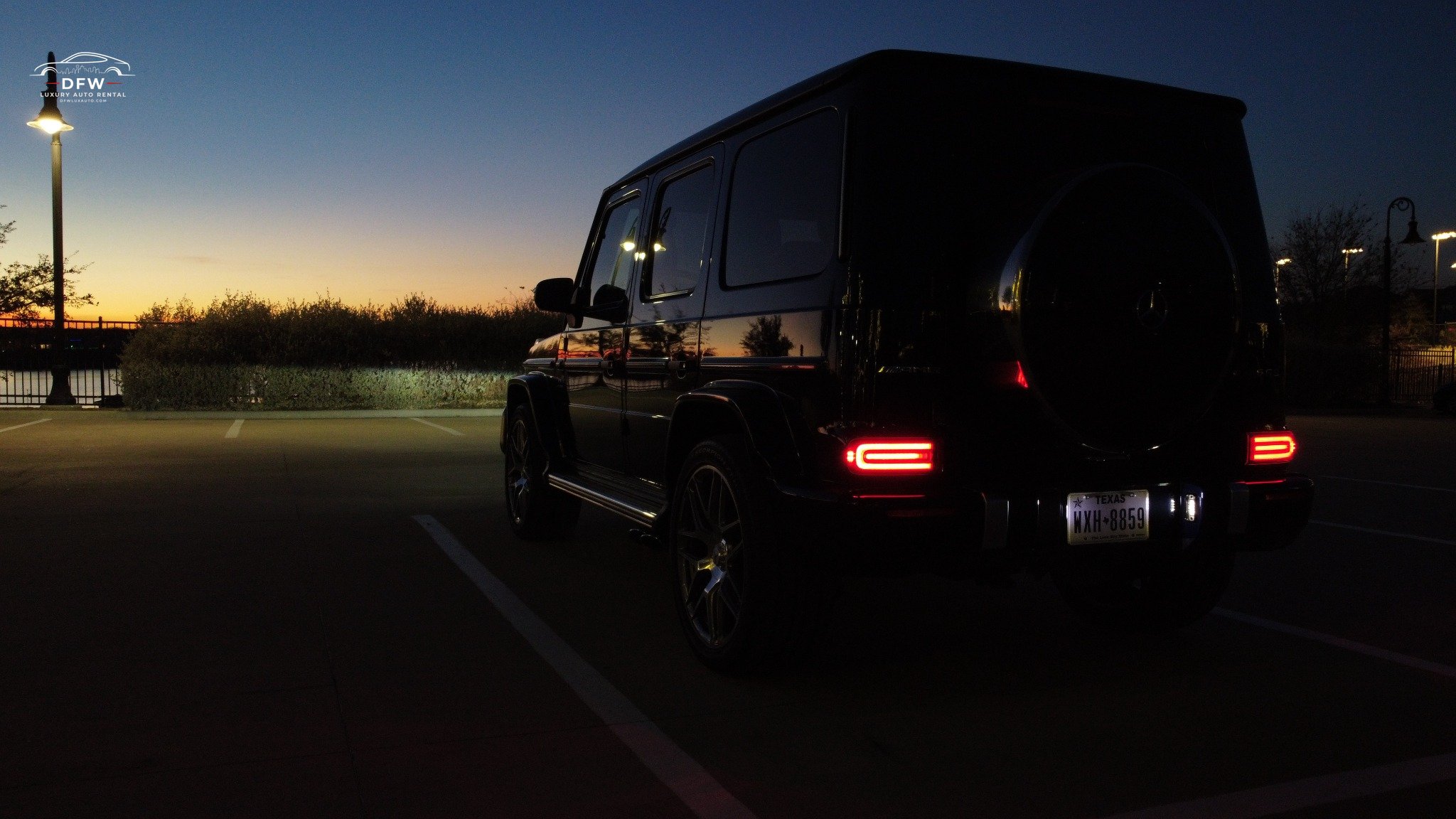 luxury car rental g wagon at dusk