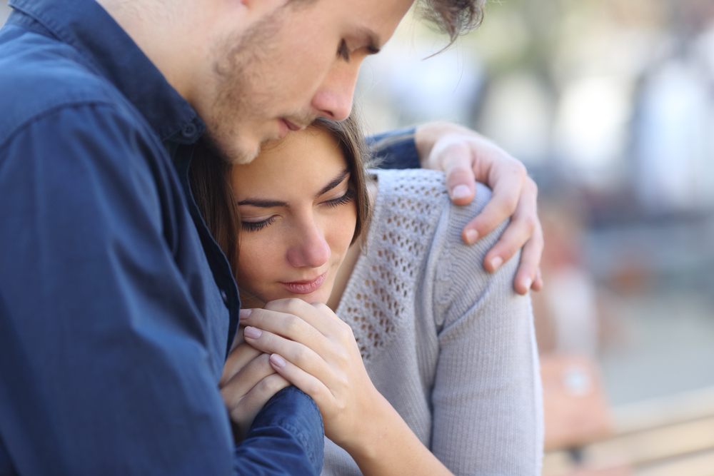 A man comforting a woman A man comforting a woman