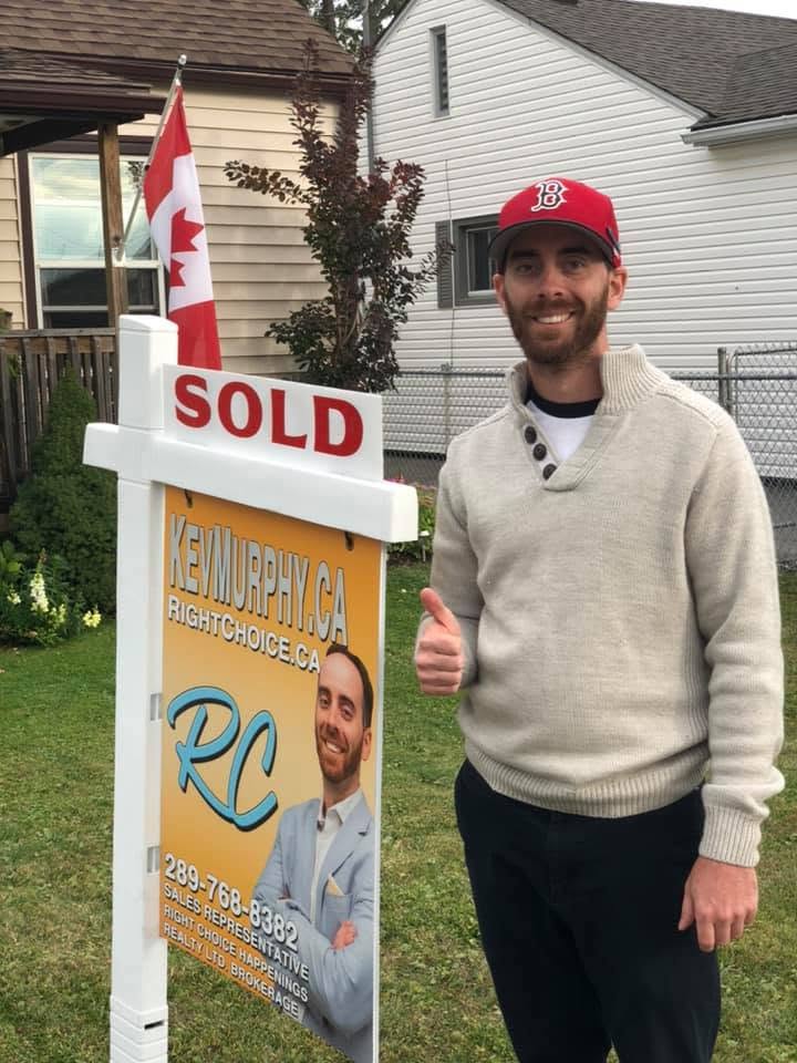 Kevin Murphy with a Sold sign