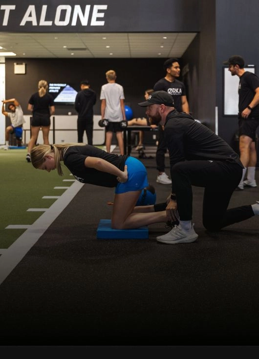 Athlete performing barbell deadlift in ØRKA gym