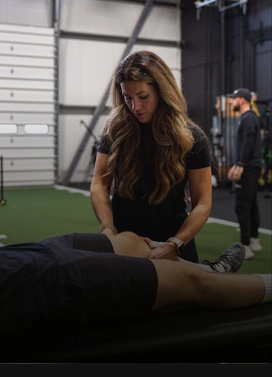 Sports medicine doctor assessing athlete injury